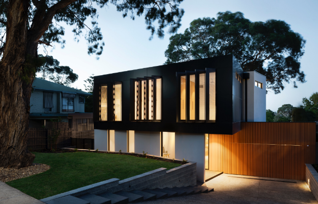 a modern home with lighting in an evening