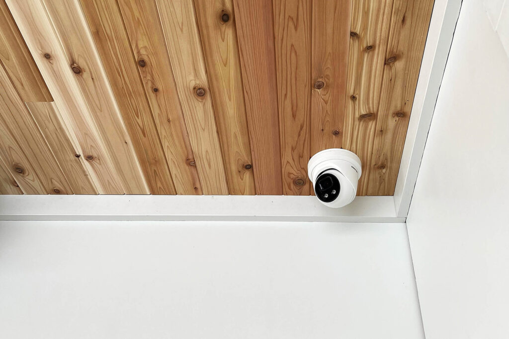 CCTV installed on a wooden ceiling